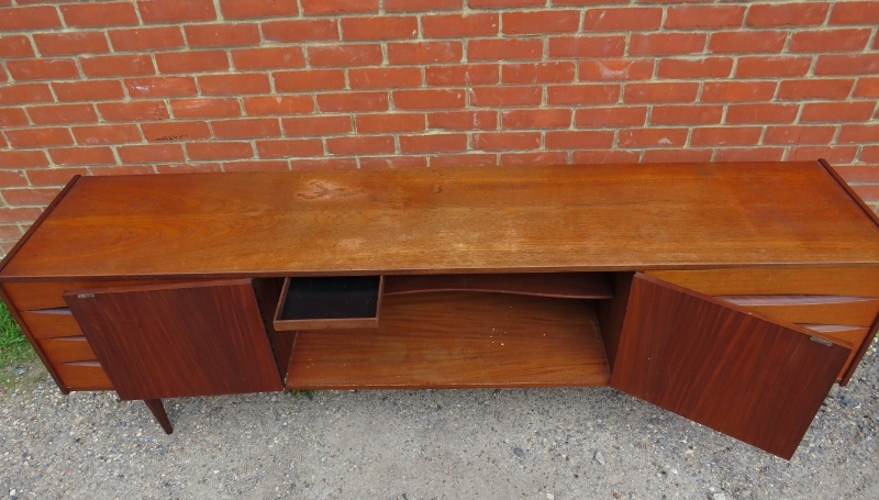 A mid-century Danish teak sideboard, the double doors with turned wooden handles, opening onto a - Image 3 of 4