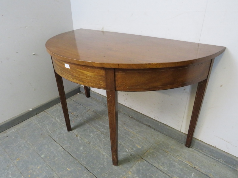 A George III mahogany demi-lune console table, strung with satinwood and boxwood, on tapered - Image 2 of 3