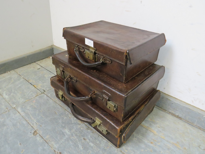 Three graduated antique leather luggage cases of good patina, with brass fittings. Largest H11cm - Image 2 of 3