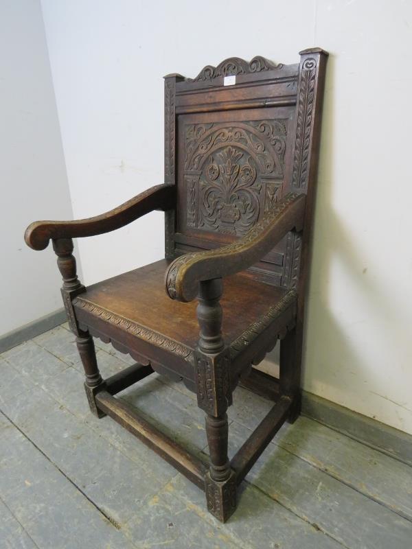 A 19th century oak Wainscott chair in the 17th century taste, the backrest profusely carved with - Image 2 of 4