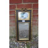 A small vintage wall mirror in the Classical taste, the parcel gilt frame with painted panel