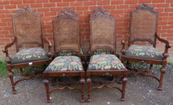 A set of 6 (4+2) early 20th century walnut dining chairs by James Shoolbred, having shell carved