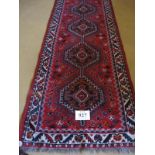 Mid to late 20th Century Persian runner, five interlocking central medallions on a red ground 252