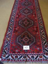 Mid to late 20th Century Persian runner, five interlocking central medallions on a red ground 252