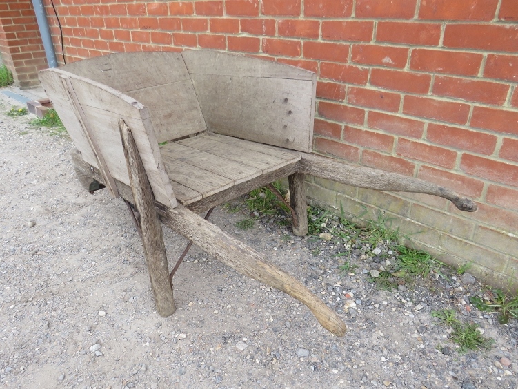 A weathered antique oak garden wheelbarrow. H72cm W155cm D67cm (approx). Condition report: Sides - Image 3 of 3