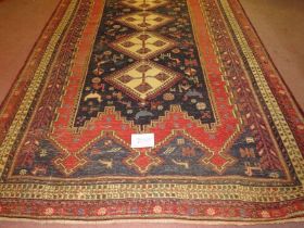 A central Persian Sumak Kilim rug, four interlocking diamond pattern to centre, cream on blue & red.