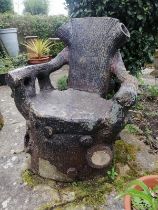 A large 19th century naturalistic stoneware garden seat, modelled as a tree stump with backrest in