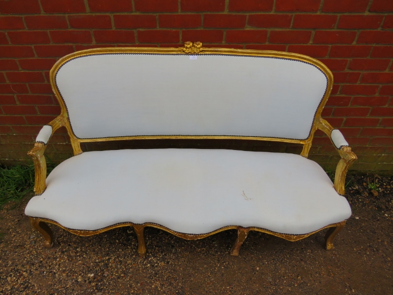 A 19th century French giltwood three-seater sofa, having a serpentine front, reupholstered in calico - Image 3 of 3