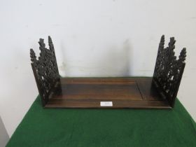 A Victorian rosewood extending tabletop bookshelf, with finely carved and pierced fretwork end