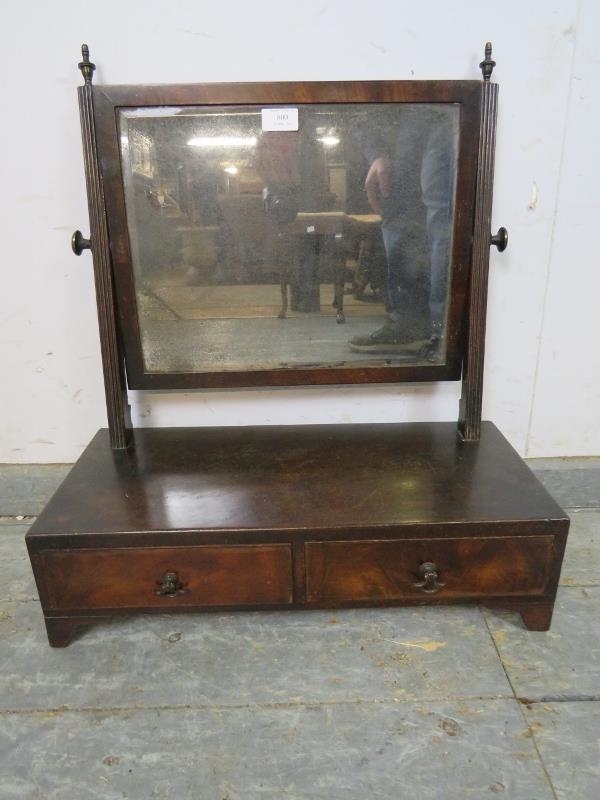 A Regency Period mahogany swing vanity mirror, retaining the original nicely silvered bevelled