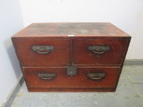 An antique Meiji Period Japanese tansu chest, having two short above one long drawer with pierced