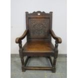 A 19th century oak Wainscott chair in the 17th century taste, the backrest profusely carved with