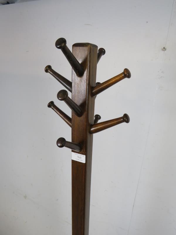 An Art Deco Period mahogany coat stand, having a selection of 10 turned peg hooks, the square column - Image 2 of 3