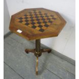 A 19th century rosewood octagonal games table, having inlaid ebony and burr walnut chessboard top,