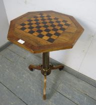 A 19th century rosewood octagonal games table, having inlaid ebony and burr walnut chessboard top,