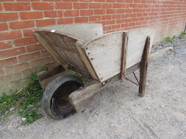 A weathered antique oak garden wheelbarrow. H72cm W155cm D67cm (approx). Condition report: Sides - Image 2 of 3