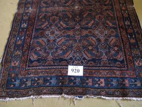 A 19 Century Persian rug. Blue on burnt amber ground 147 x 112cms Condition report: Some age related