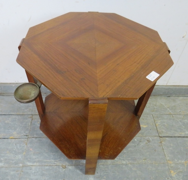 An Art Deco Period walnut octagonal two-tier table, the quarter veneered top with swing-out brass - Bild 3 aus 3