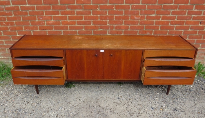 A mid-century Danish teak sideboard, the double doors with turned wooden handles, opening onto a - Image 4 of 4