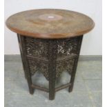 An early 20th century Angle Indian hardwood occasional table, the circular top with relief carving