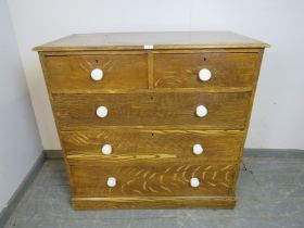 A Victorian pine chest retaining the original scumbled paintwork, housing two short over three
