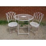 A steel garden set painted white comprising a circular folding table with radial wirework