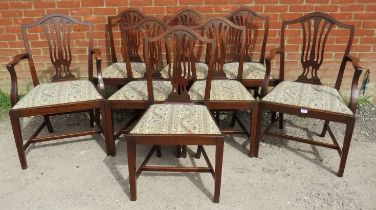 A set of eight (6+2) antique Georgian Revival mahogany dining chairs, the shield backs with shaped