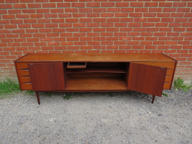 A mid-century Danish teak sideboard, the double doors with turned wooden handles, opening onto a - Image 2 of 4