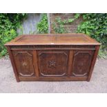 A large antique oak and pitch pine panelled coffer in the 17th century taste, the front with blind