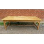 An antique pine refectory style farmhouse table, the planked top on square supports united by an ‘H’