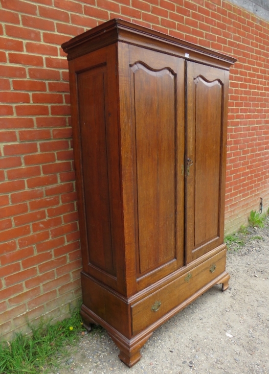 An 18th century Continental oak linen press/wardrobe, having fielded front and side panels, the - Image 2 of 3