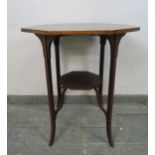 An Edwardian mahogany octagonal table, crossbanded and strung with ebony and boxwood, on inlaid