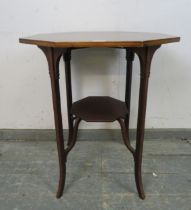 An Edwardian mahogany octagonal table, crossbanded and strung with ebony and boxwood, on inlaid