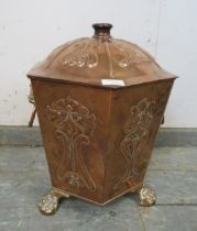 An Arts & Crafts Period hexagonal copper coal bucket, having repousse decoration and lion mask