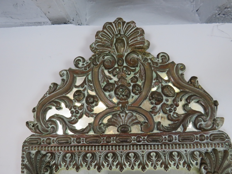 A 19th century Napoleon III cushion wall mirror, the sectioned mirror plates within a brass repousse - Image 3 of 3