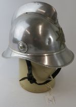 A 1980s Swedish Gothenburg Fire Service polished steel fire helmet.