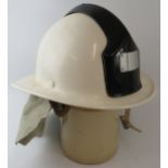 A 1990s Czechoslovakia Fire Service white Ergon fibreglass fire helmet with leather neck cowl