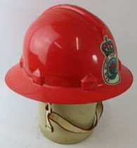 A 1980s Australian New South Wales Bush Fire Brigade orange ABS fire helmet