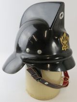 A 1980s Mexican Mexico City Fire Service fire helmet with brass badge .