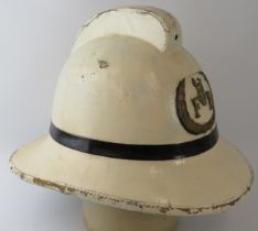 A 1960s British Army Fire Service white cork fire helmet
