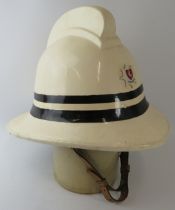 A 1970s British Kent Fire Brigade Divisional Officer's white fire helmet.