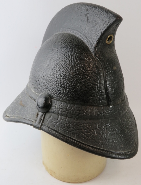 A 1950s British black leather Hendry fire helmet