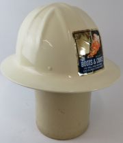 A 1999 US Boots & Coots Oil Well Firefighters white alloy fire helmet