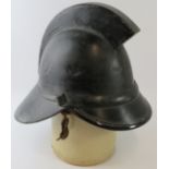 A 1920s British leather Hendry fire helmet with square comb