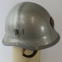 A 1970s Hungarian Fire Service fibreglass fire helmet.