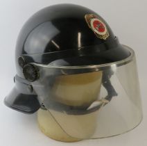 A 1980s Panama Fire Service black ABS fire helmet with visor