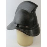 A 1950s British black leather Hendry fire helmet
