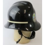 A 1970s Spanish Seville Fire Service ABS black fire helmet.