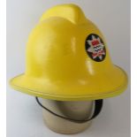A 1980s British London Fire Brigade yellow fire helmet