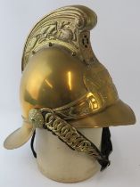 An Australian New South Wales Fire Service replica brass fire helmet with chain link chin strap,